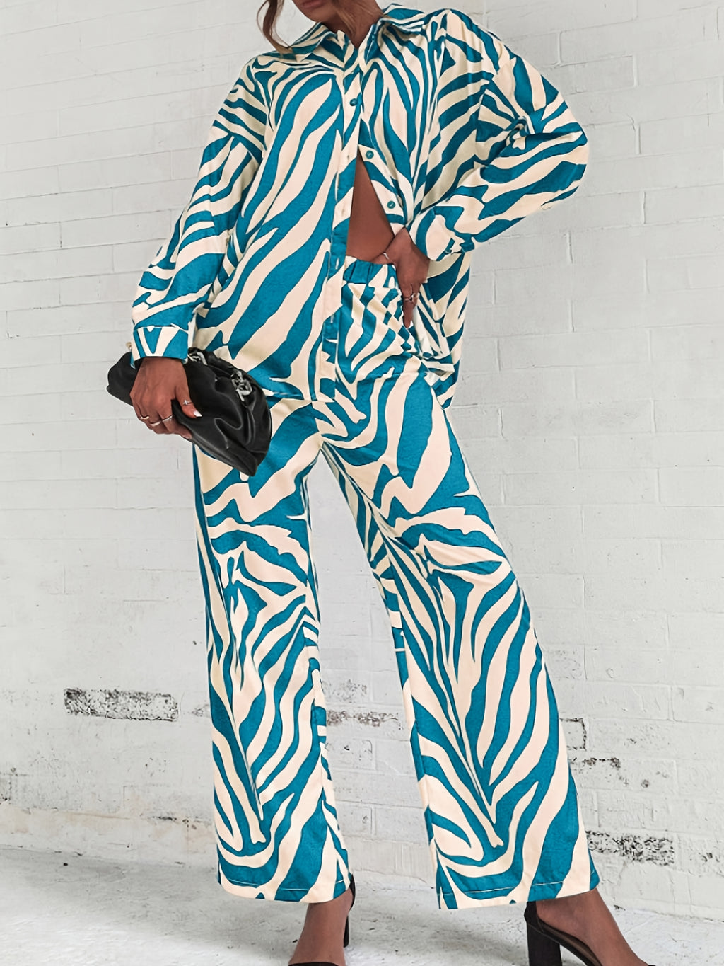 A two-piece home wear set featuring a Women's printed pajama button- lapel top and loose wide-leg pants