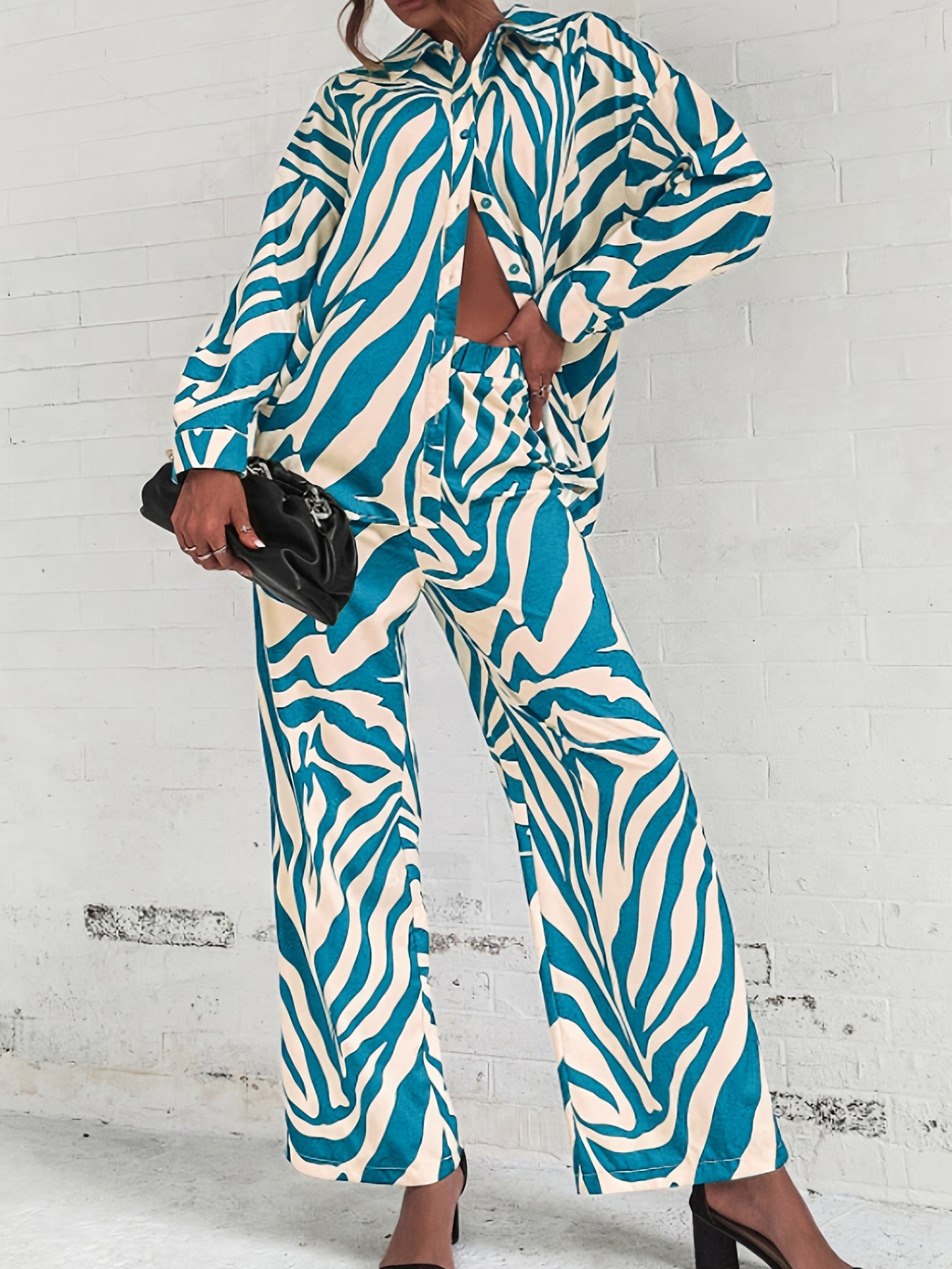 A two-piece home wear set featuring a Women's printed pajama button- lapel top and loose wide-leg pants