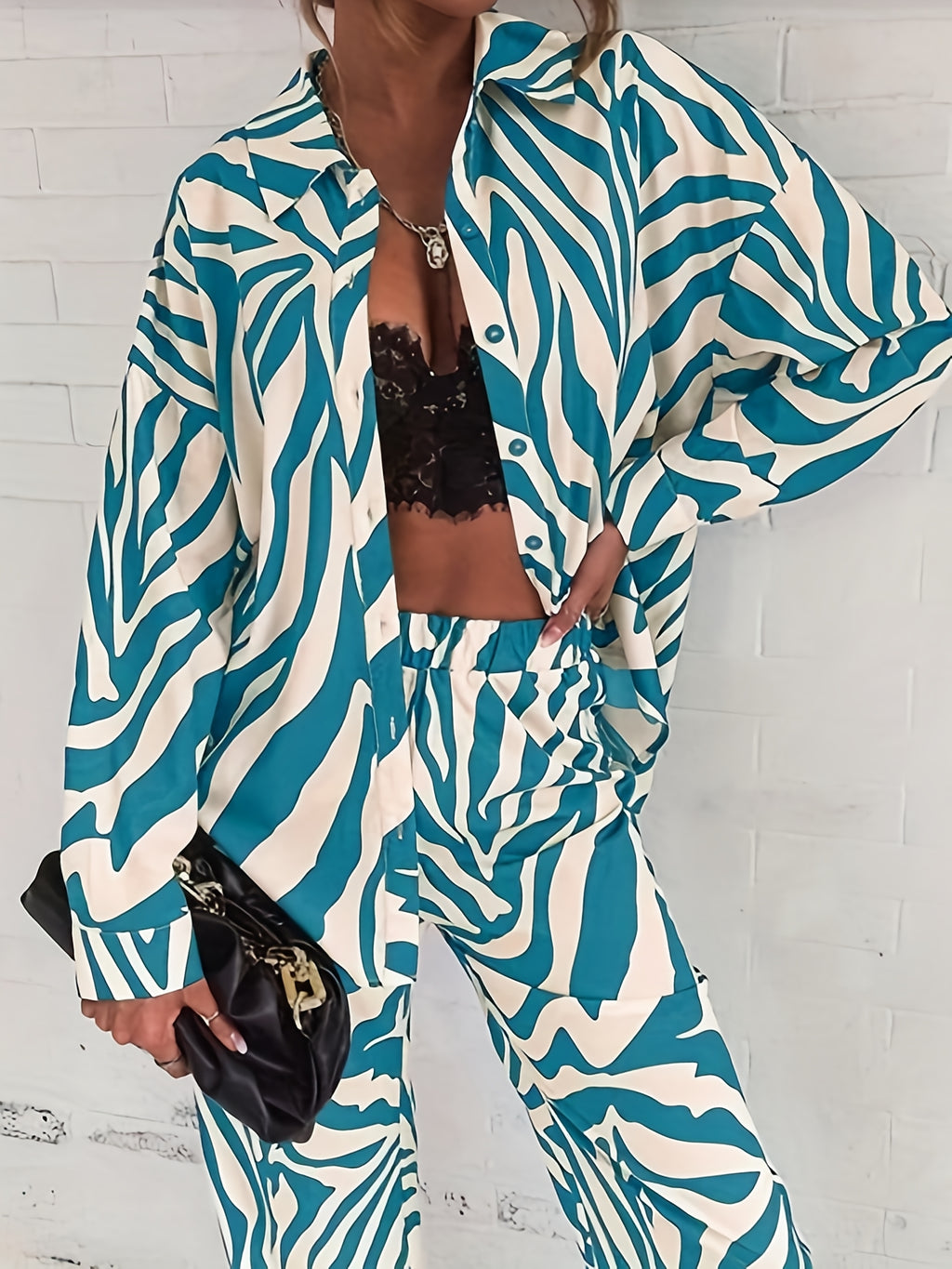 A two-piece home wear set featuring a Women's printed pajama button- lapel top and loose wide-leg pants