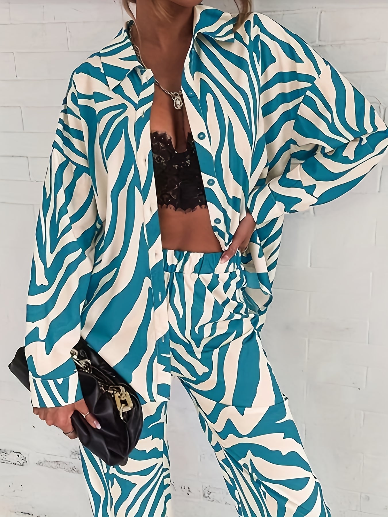 A two-piece home wear set featuring a Women's printed pajama button- lapel top and loose wide-leg pants